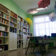 At Manolis Andronikos Gymnasio, a 100-student elementary school in Vergina, teachers have hung umbrellas from the ceiling to bring color to their very small library.